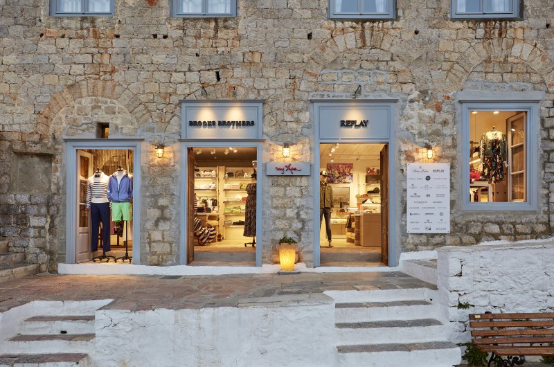 MyHydra Concept Store — stone building exterior at Hydra port, daytime